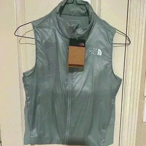 Brand NWT North Face Women’s Vest. Lightweight, color is listed as silver blue.